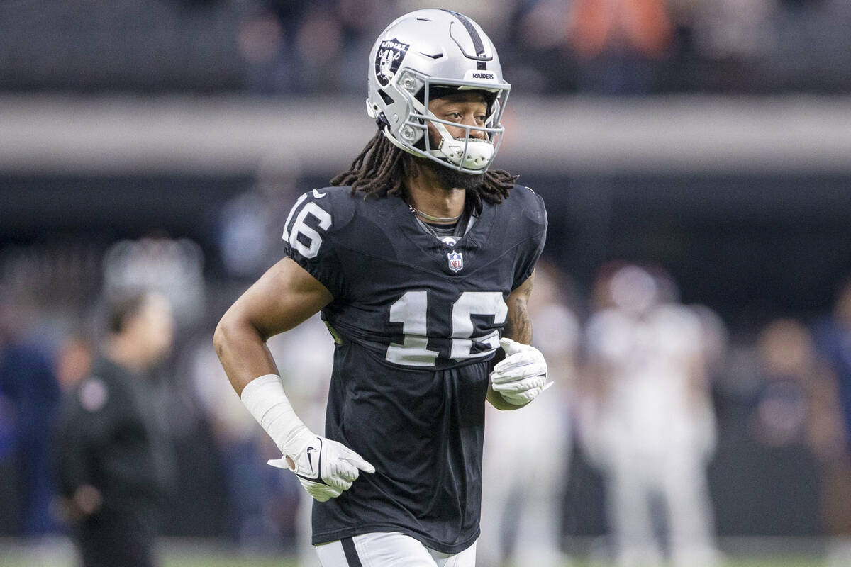 Raiders wide receiver Jakobi Meyers (16) warms up before an NFL game against the Denver Broncos ...