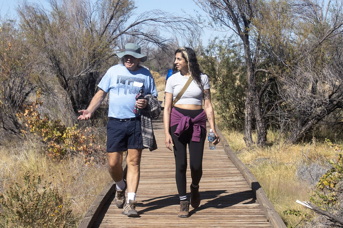 Lawyer Verónica Gostissa, right, of Argentina, walks toward Crystal Springs during the Climat ...