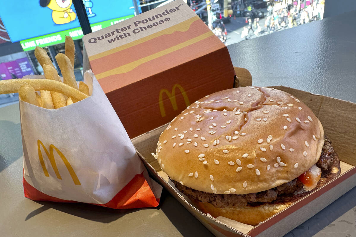 A McDonald's Quarter Pounder hamburger and fries are shown in this photograph, in New York's Ti ...