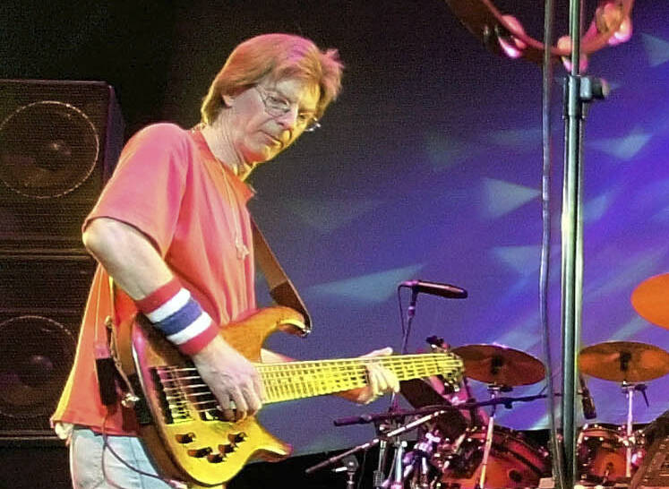 Phil Lesh, of The Grateful Dead, performs during a reunion concert in East Troy, Wis. on Aug. 3 ...