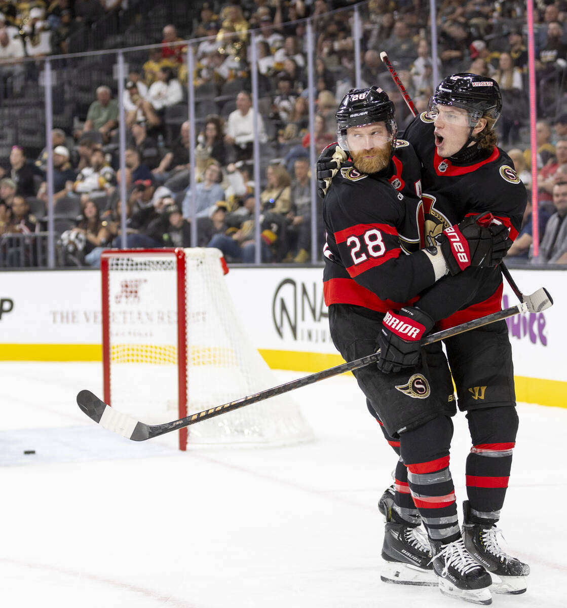 Ottawa Senators right wing Adam Gaudette, right, and right wing Claude Giroux (28) celebrate a ...