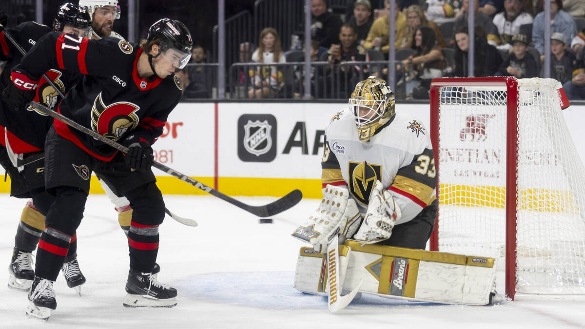 Golden Knights goaltender Adin Hill (33) blocks a shot during the second period of the NHL hock ...