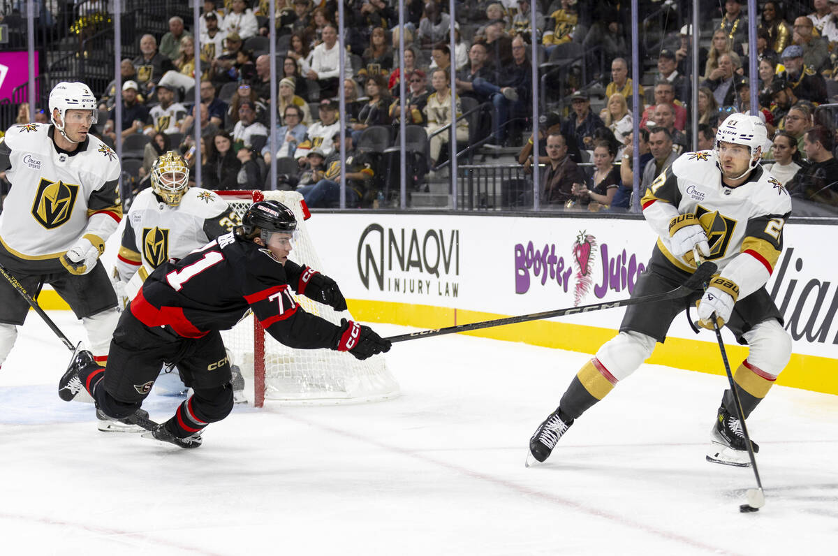 Ottawa Senators center Ridly Greig (71) dives after Golden Knights defenseman Shea Theodore (27 ...