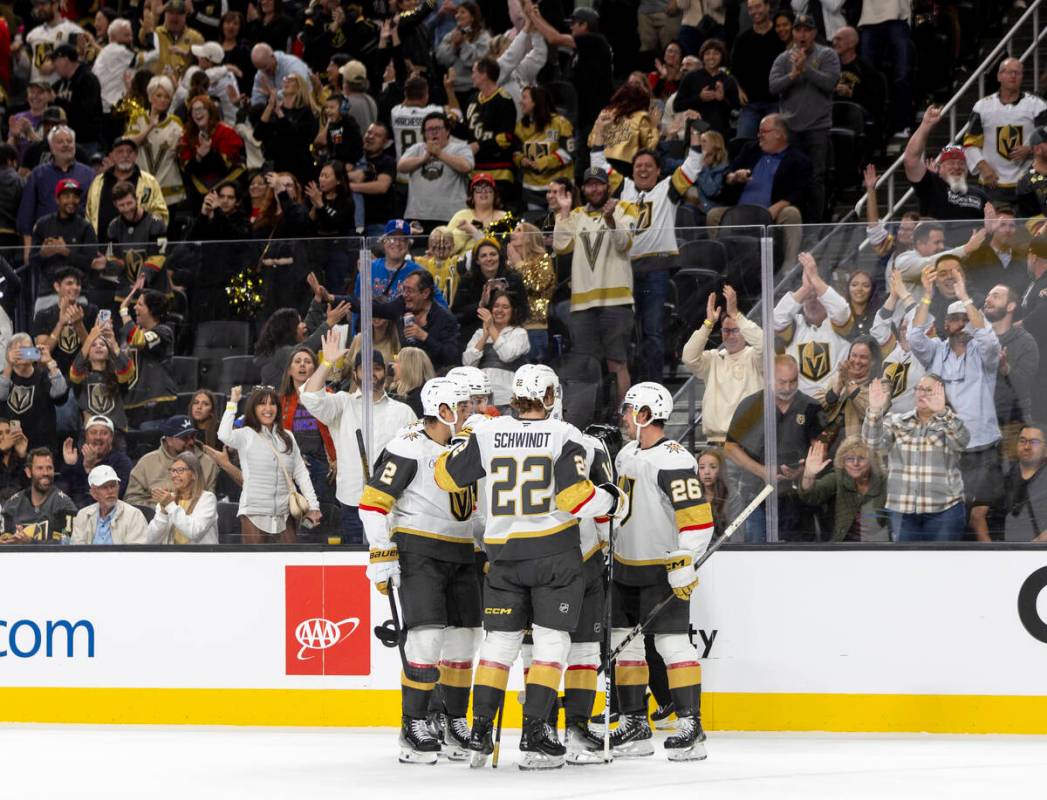 The Golden Knights celebrate a goal during the first period of the NHL hockey game against the ...