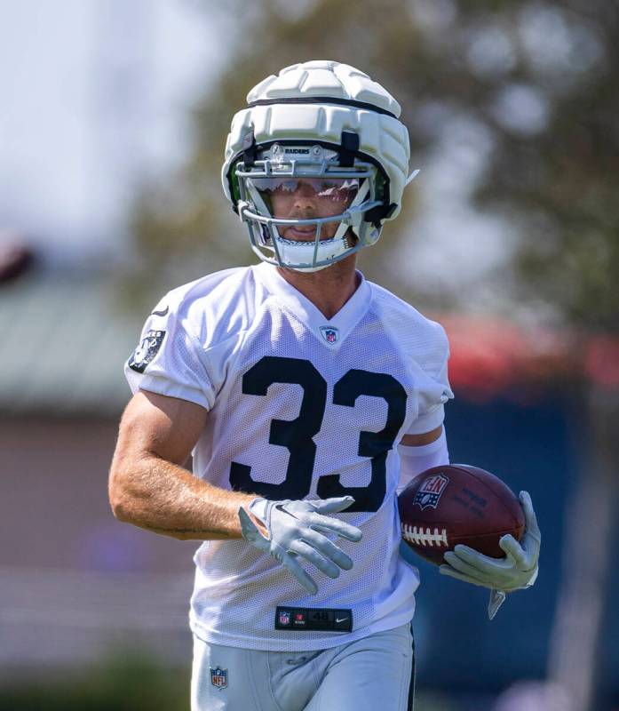 Raiders wide receiver Alex Bachman (33) runs after catching a pass during the first day of Raid ...