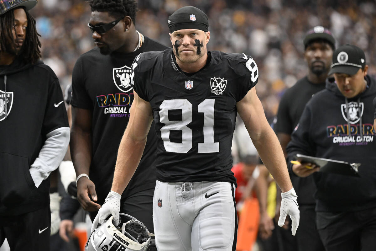 Las Vegas Raiders wide receiver Alex Bachman walks on the field during an NFL football game aga ...