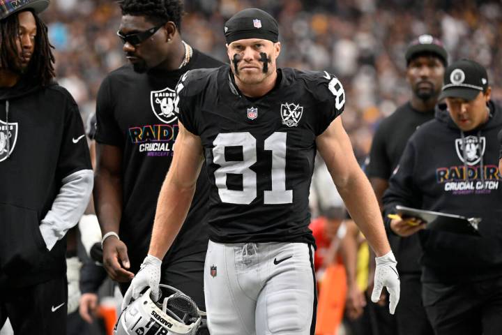 Las Vegas Raiders wide receiver Alex Bachman walks on the field during an NFL football game aga ...