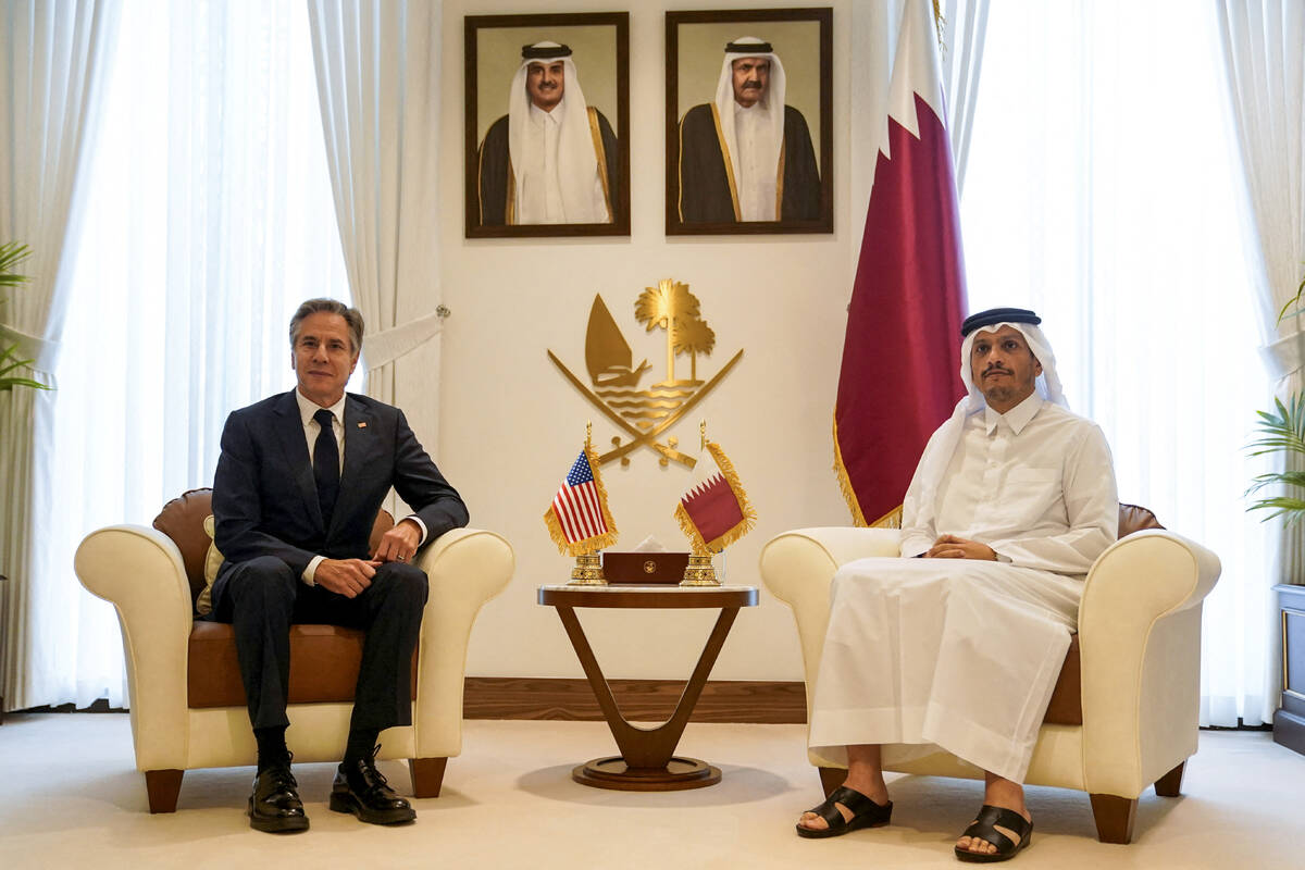 U.S. Secretary of State Antony Blinken, left, and Qatari Prime Minister and Foreign Minister Mo ...