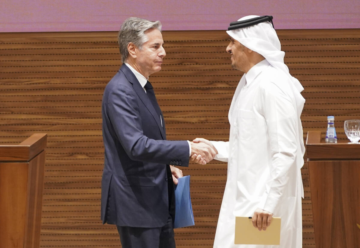 U.S. Secretary of State Antony Blinken, left, and Qatari Prime Minister and Foreign Minister Mo ...