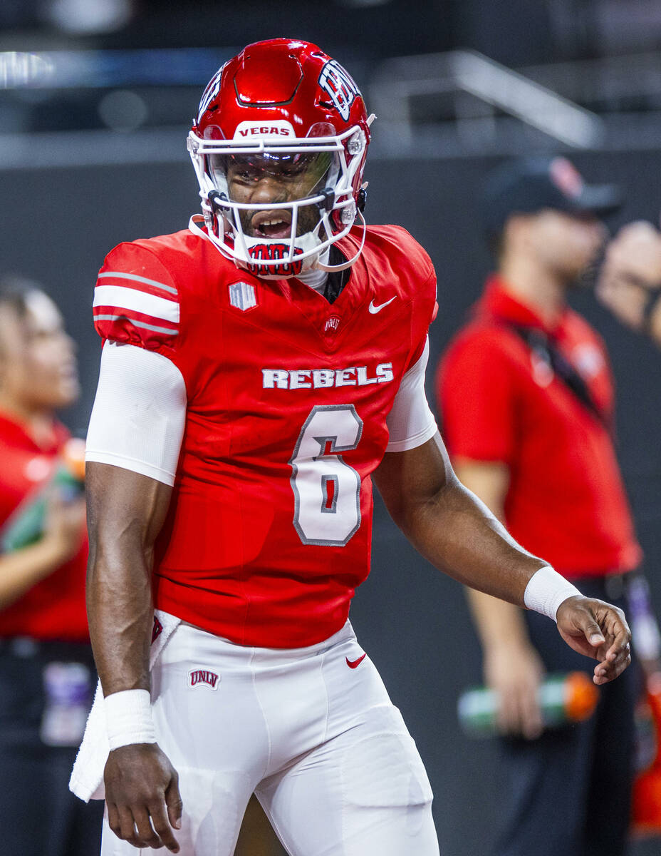 UNLV quarterback Hajj-Malik Williams (6) speaks to a teammate during warm ups of their NCAA foo ...