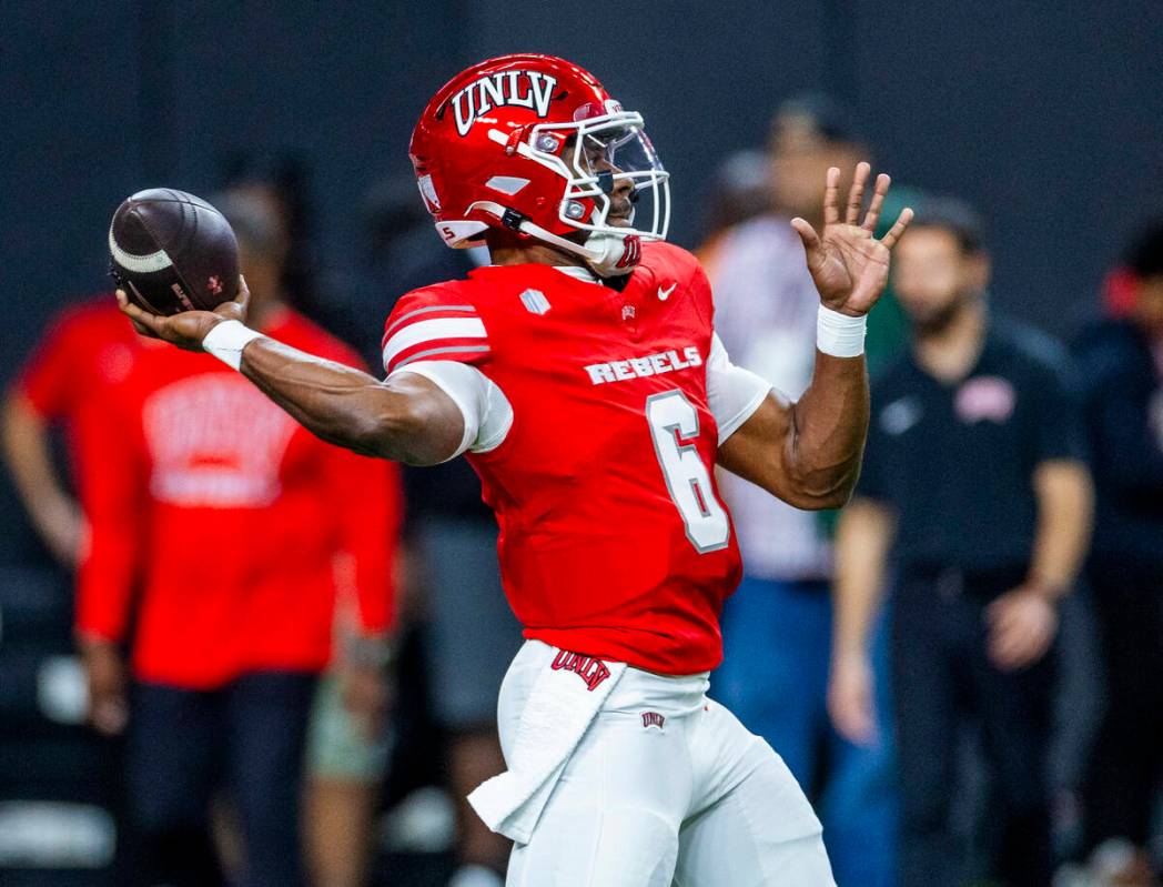 UNLV quarterback Hajj-Malik Williams (6) gets off a pass during warm ups of their NCAA football ...