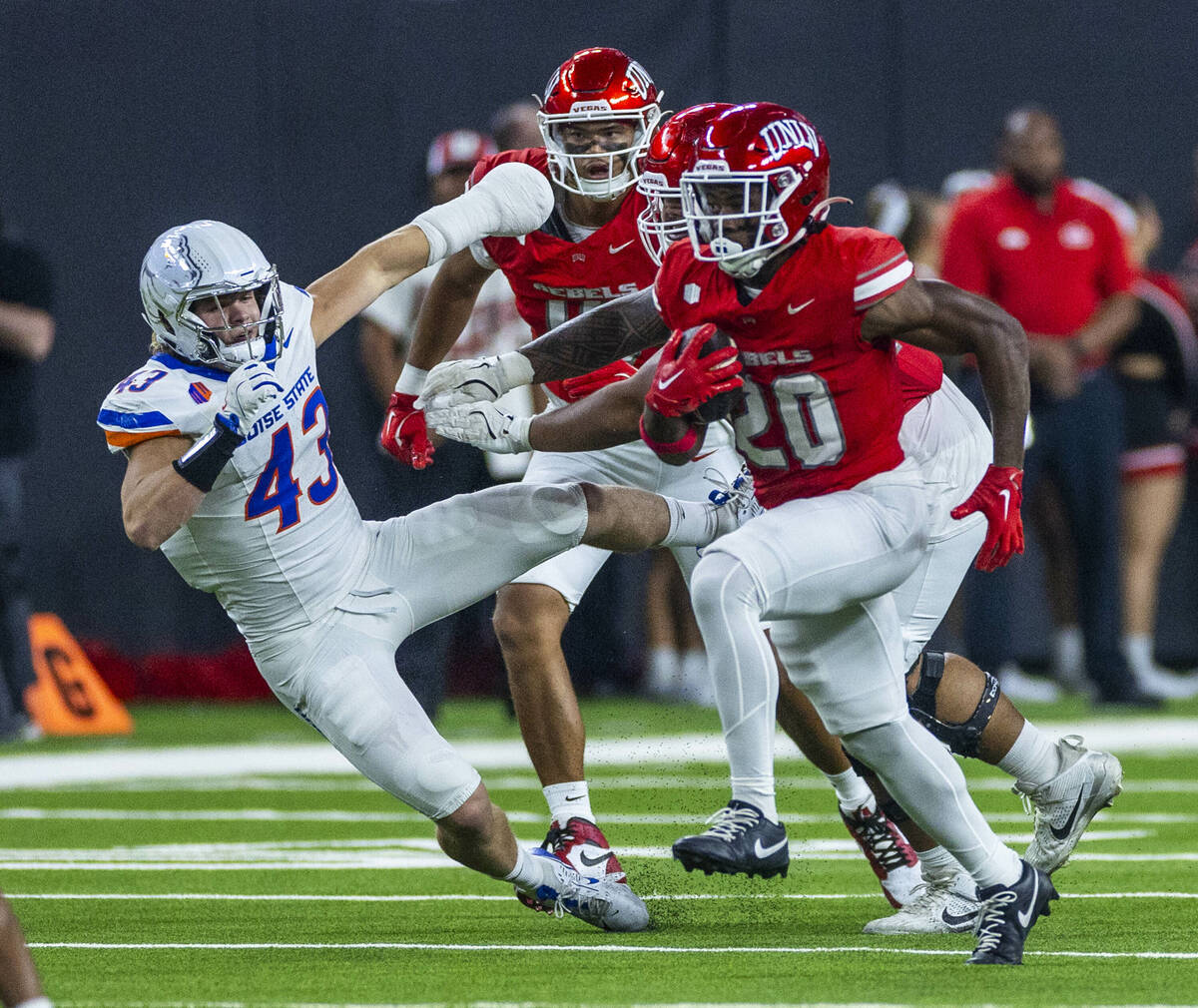 UNLV running back Kylin James (20) breaks for open ground as Boise State Broncos linebacker Jak ...