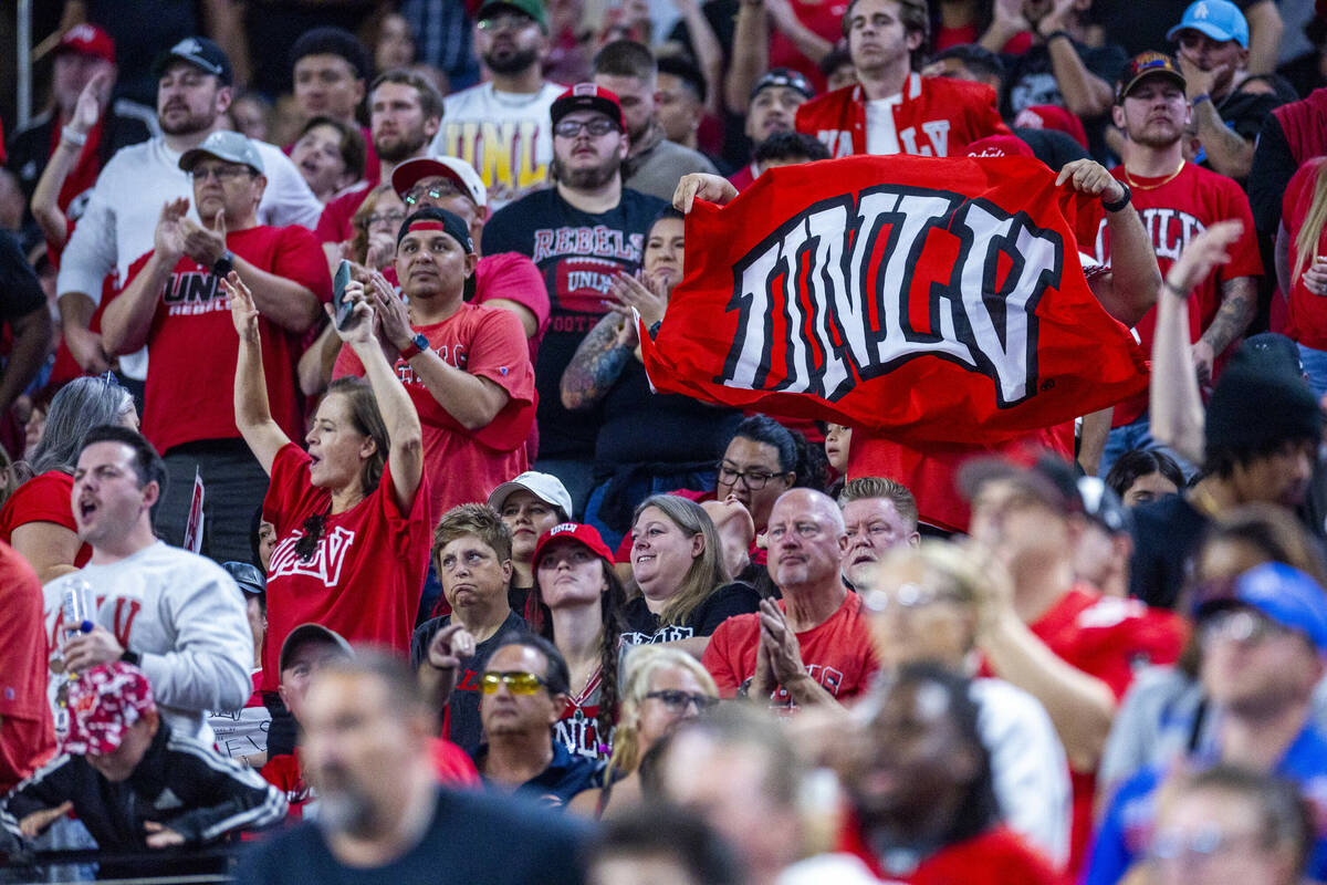 UNLV fans attempt to stay upbeat after another Boise State Broncos score during the first half ...