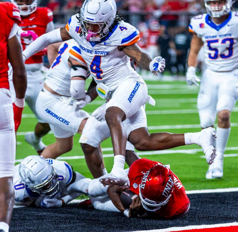 UNLV quarterback Hajj-Malik Williams (6) falls into the end zone for a score as Boise State Bro ...