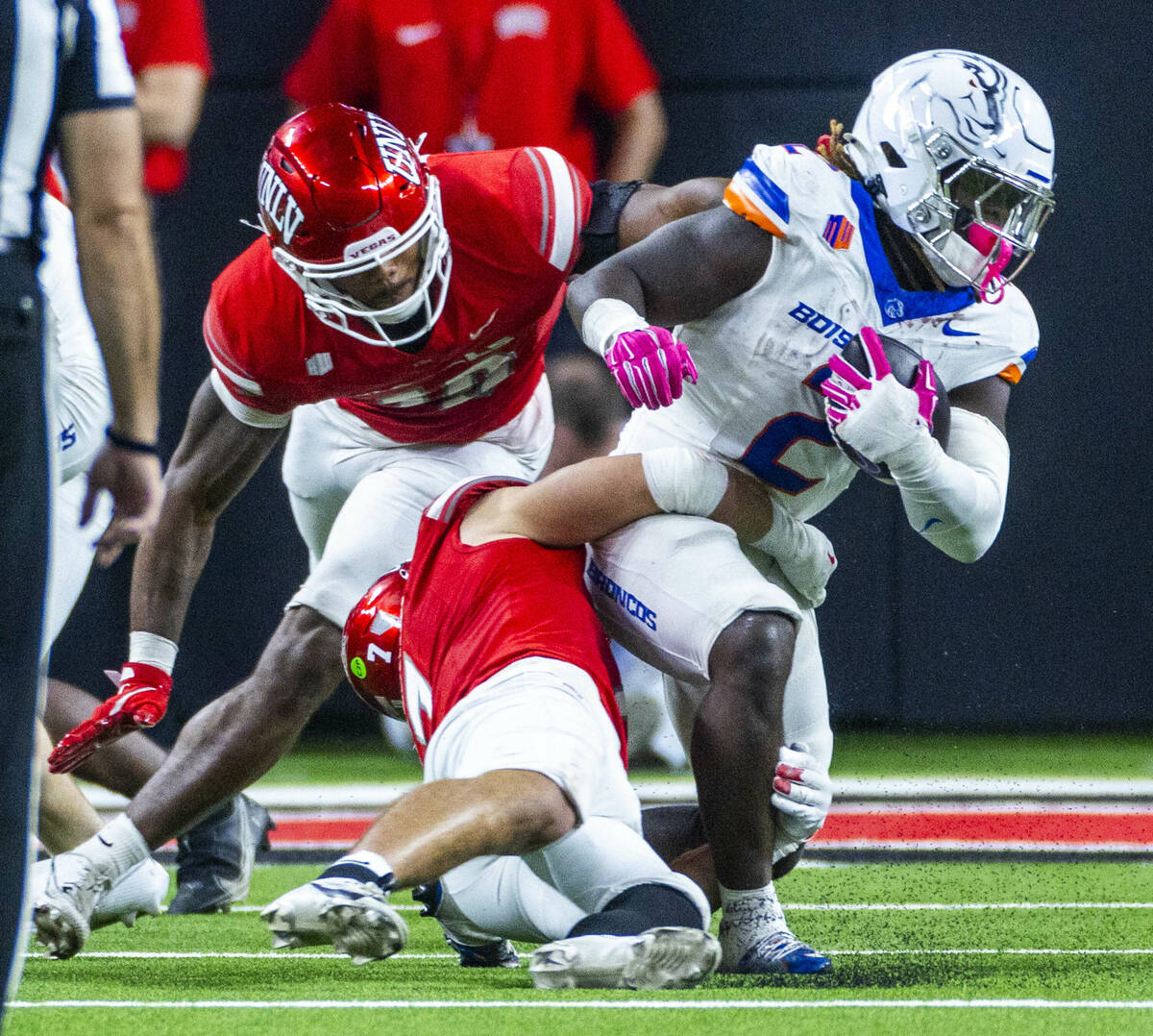 Boise State Broncos running back Ashton Jeanty (2) is turned back by UNLV linebacker Jackson Wo ...