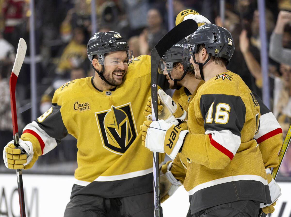 Golden Knights center Tomas Hertl (48) joins his teammates in celebrating after a goal is score ...