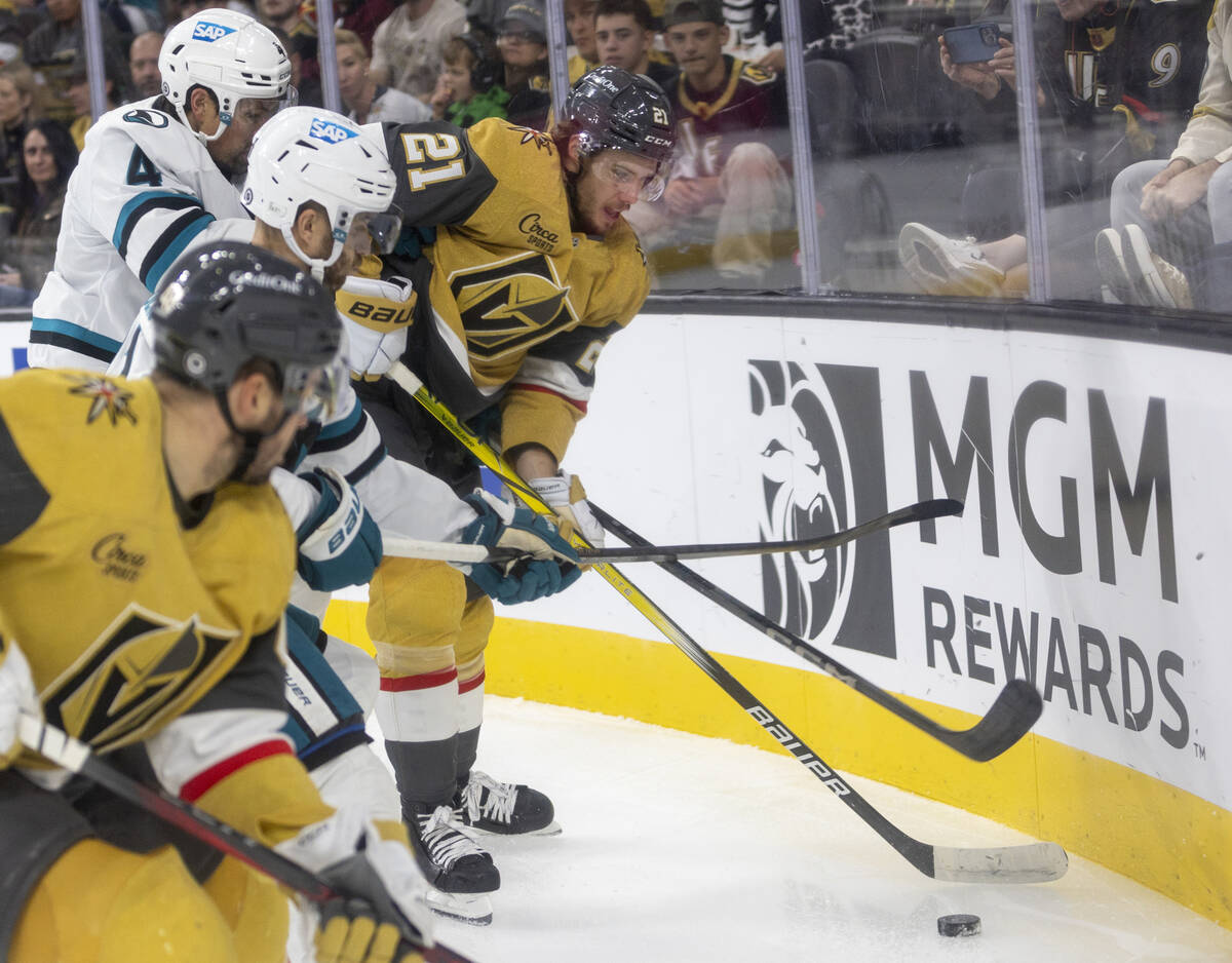 Golden Knights center Brett Howden (21) fights for the puck along the boards during the first p ...