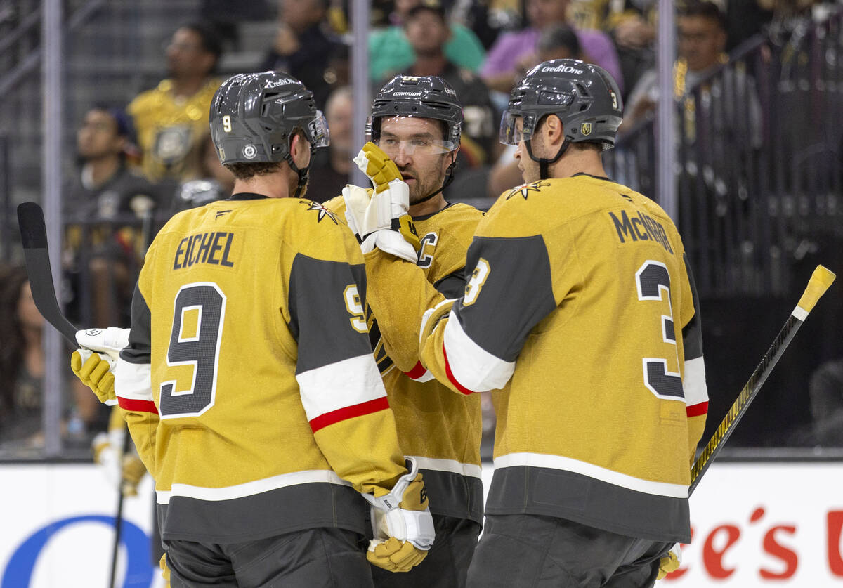 Golden Knights right wing Mark Stone, center, talks to center Jack Eichel (9) and defenseman Br ...