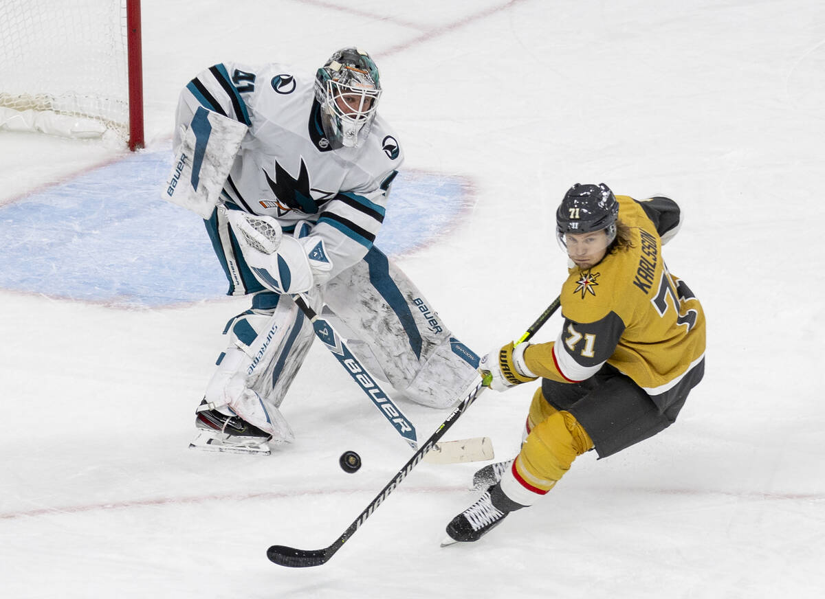 San Jose Sharks goaltender Vitek Vanecek (41) shoots the puck past Golden Knights center Willia ...