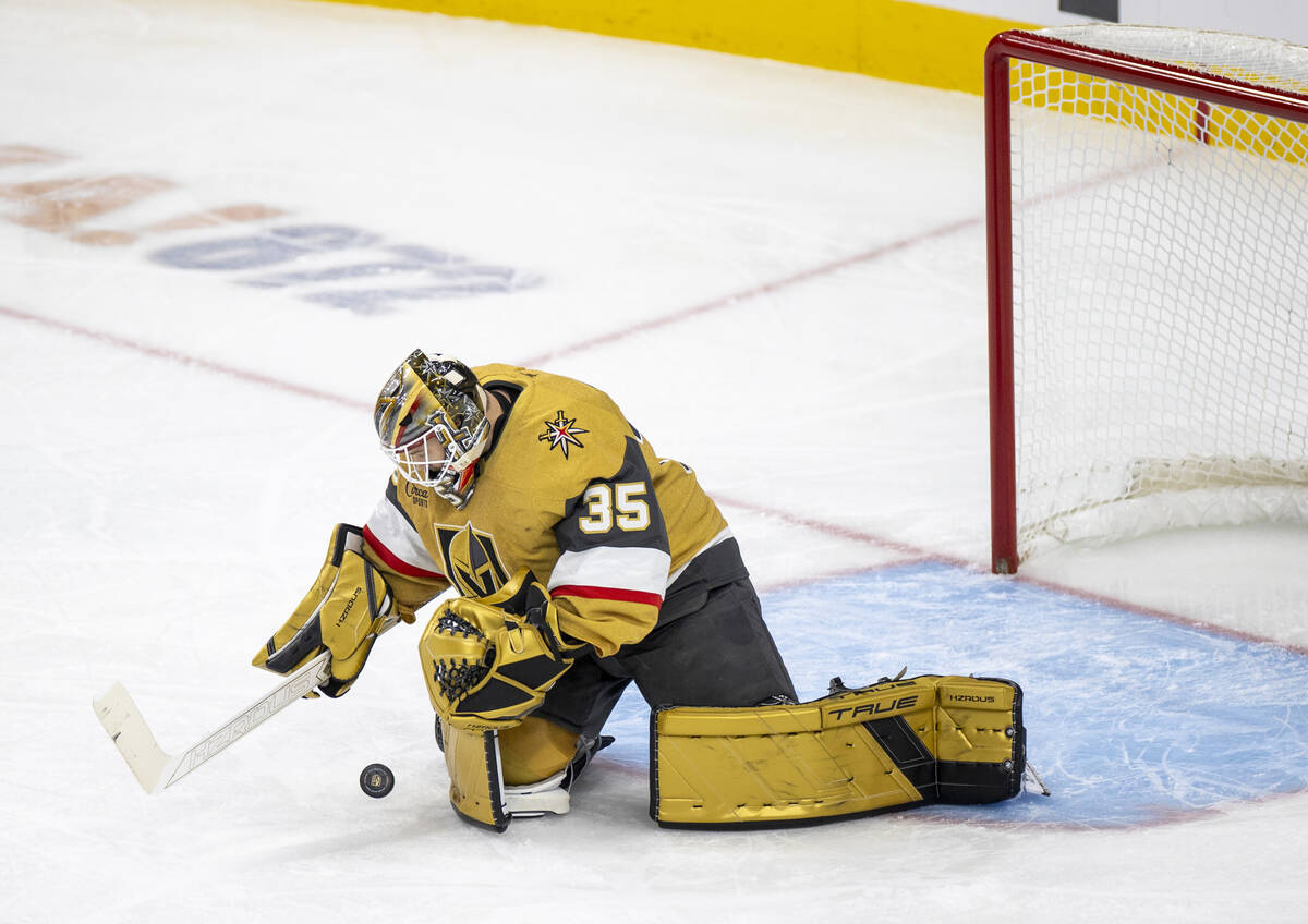 Golden Knights goaltender Ilya Samsonov (35) looks to cover the puck during the third period of ...