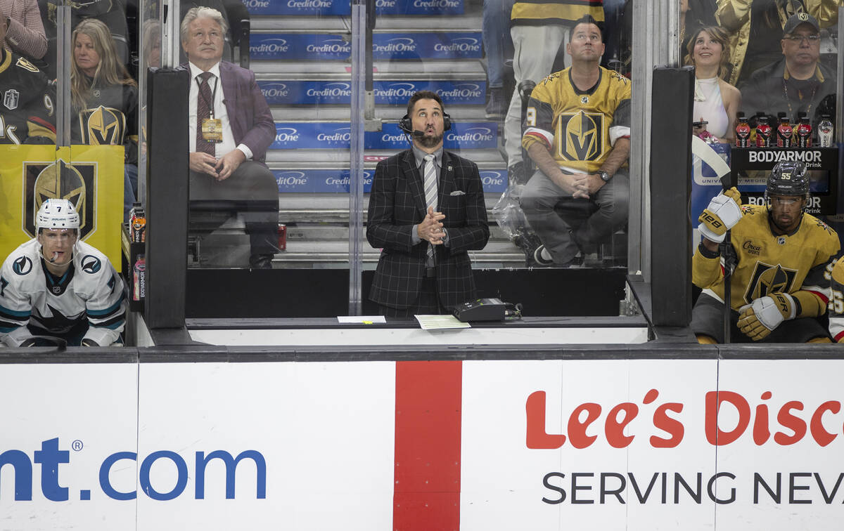 Color commentator Shane Hnidy reports between the team benches during the third period of the N ...