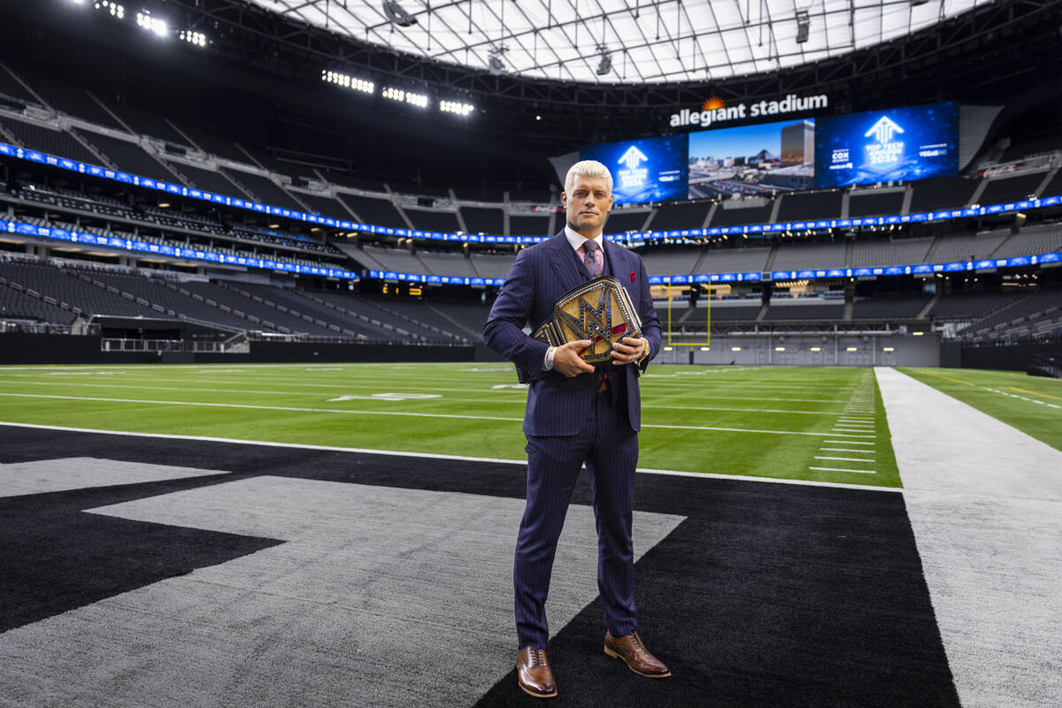 WWE superstar Cody Rhodes poses with the Undisputed WWE Championship belt at Allegiant Stadium ...