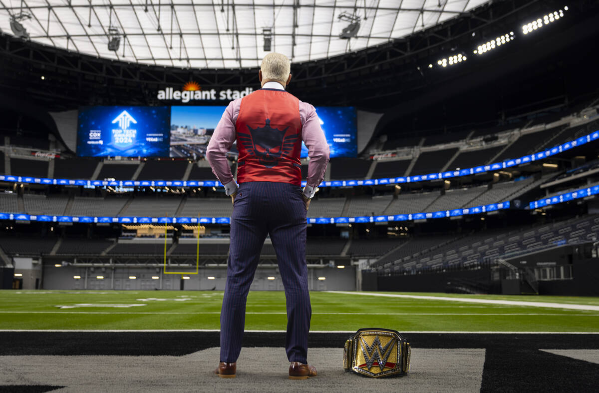 WWE superstar Cody Rhodes poses with the Undisputed WWE Championship belt at Allegiant Stadium ...