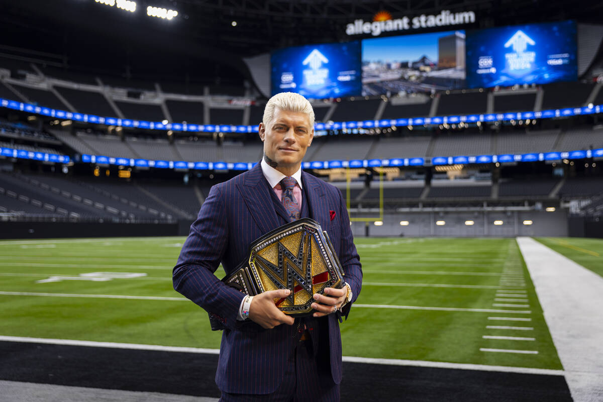 WWE superstar Cody Rhodes poses with the Undisputed WWE Championship belt at Allegiant Stadium ...