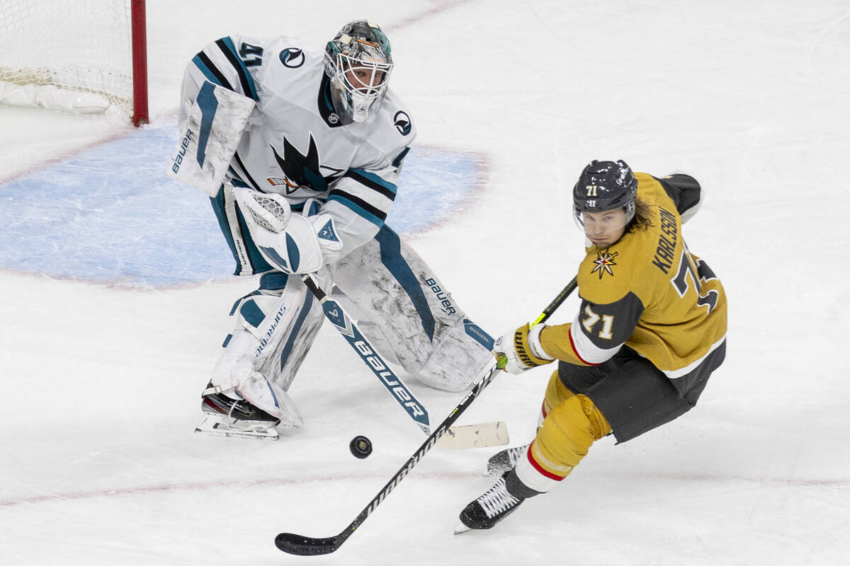 San Jose Sharks goaltender Vitek Vanecek (41) shoots the puck past Golden Knights center Willia ...