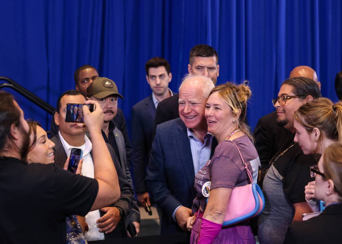 Democratic vice presidential candidate Tim Walz takes a photo with supporters following a &#x20 ...