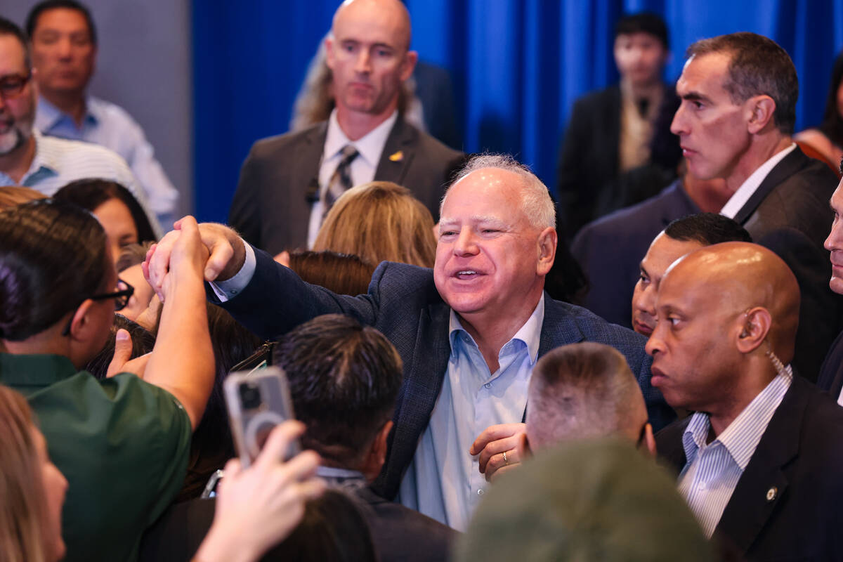 Democratic vice presidential candidate Tim Walz greets supporters following a “Native Am ...