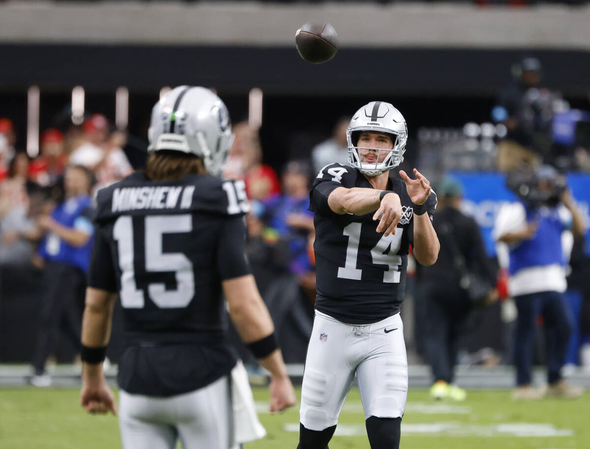 Raiders quarterback Gardner Minshew (15) and quarterback Carter Bradley (14) during a warm up p ...