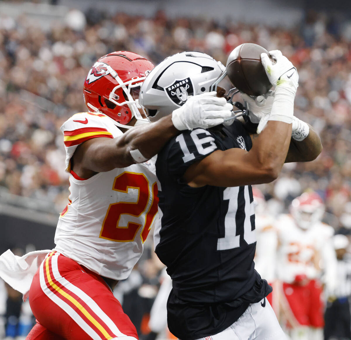 Raiders wide receiver Jakobi Meyers (16) catches a touchdown pass as Kansas City Chiefs safety ...