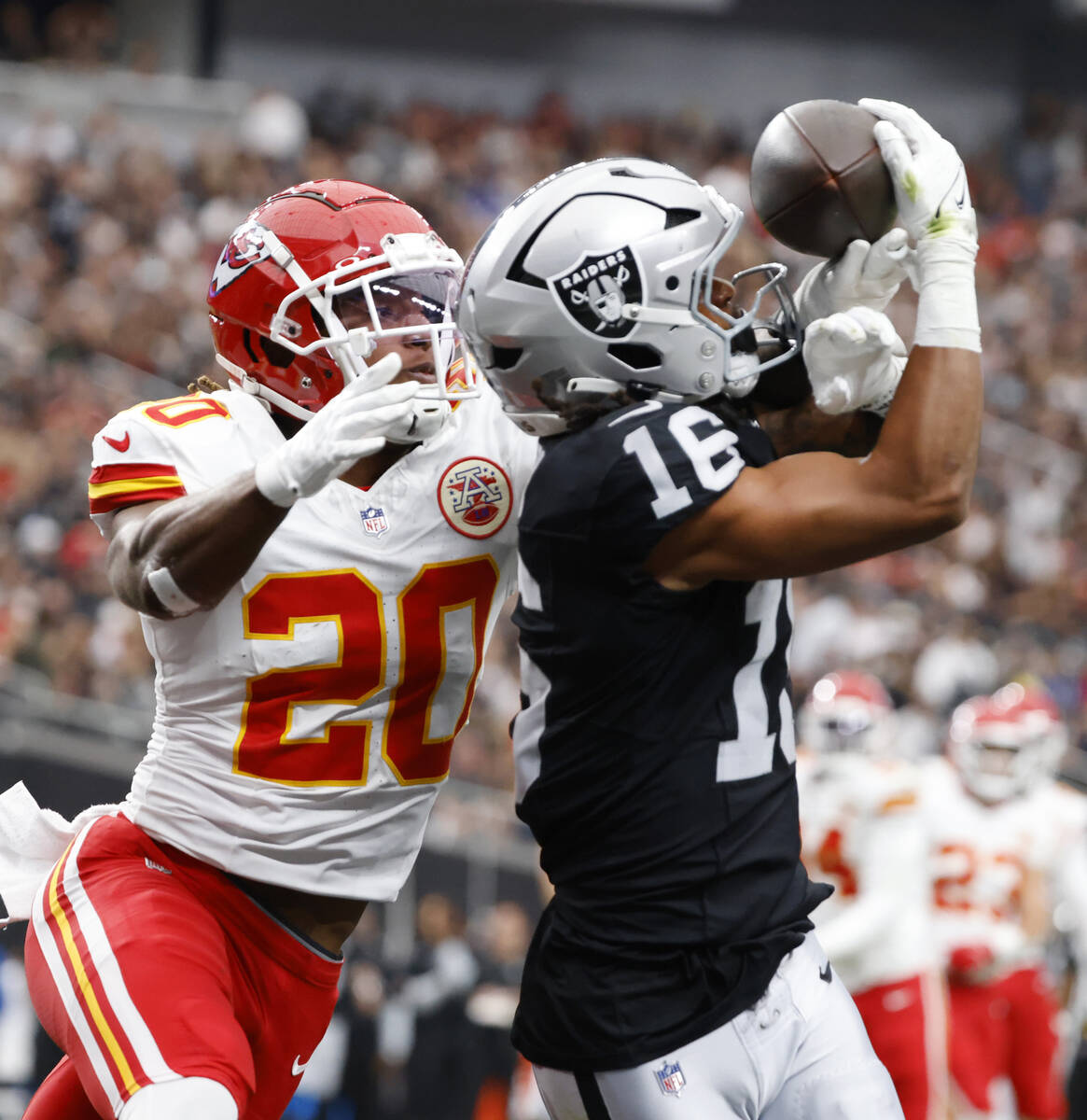 Raiders wide receiver Jakobi Meyers (16) catches a touchdown pass as Kansas City Chiefs safety ...