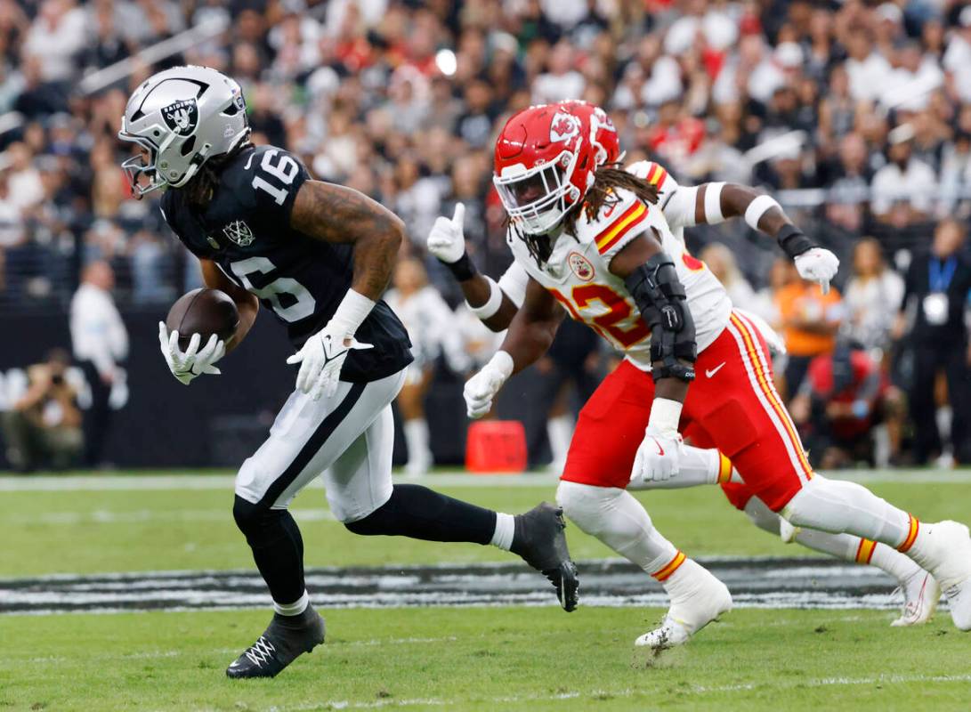 Raiders wide receiver Jakobi Meyers (16) is chased by Kansas City Chiefs linebacker Nick Bolton ...