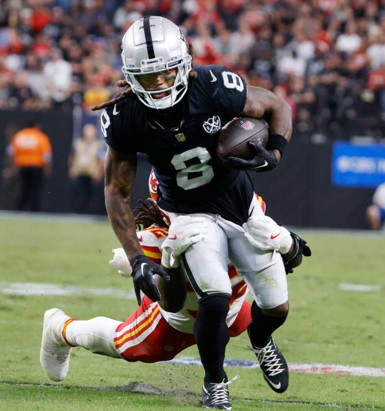 Kansas City Chiefs linebacker Nick Bolton (32) tries to take down Raiders running back Ameer Ab ...