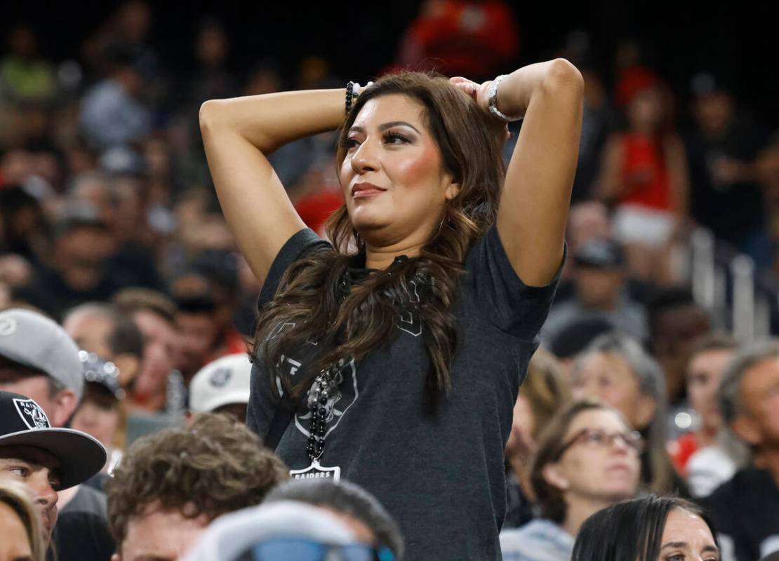 A Raiders fan reacts as she watches the last minutes of an NFL game against Kansas City Chiefs ...