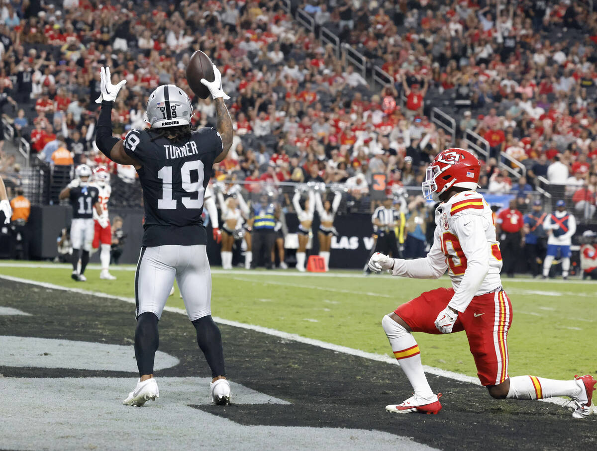 Raiders wide receiver DJ Turner (19) signals after scoring a touchdown as Kansas City Chiefs co ...