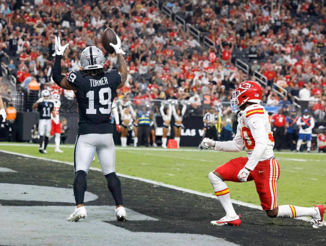 Raiders wide receiver DJ Turner (19) signals after scoring a touchdown as Kansas City Chiefs co ...