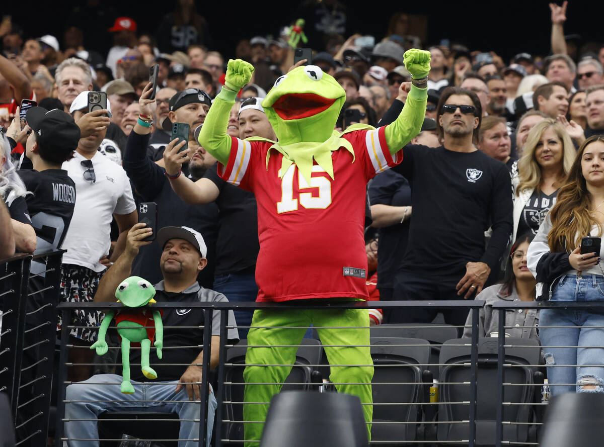 A Kansas City Chiefs fan, wearing Kansas City Chiefs quarterback Patrick Mahomes' jersey, cheer ...