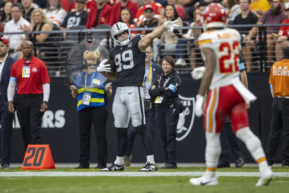 Raiders tight end Brock Bowers (89) signals for a first down after a catch during the first hal ...