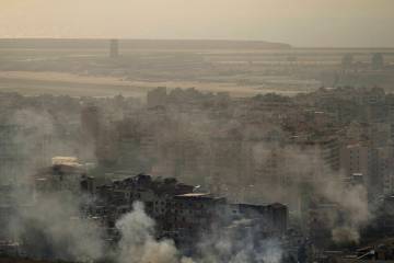 Smoke rises from an Israeli airstrike in Dahiyeh, Beirut, Sunday, Oct. 27, 2024. (AP Photo/Hass ...