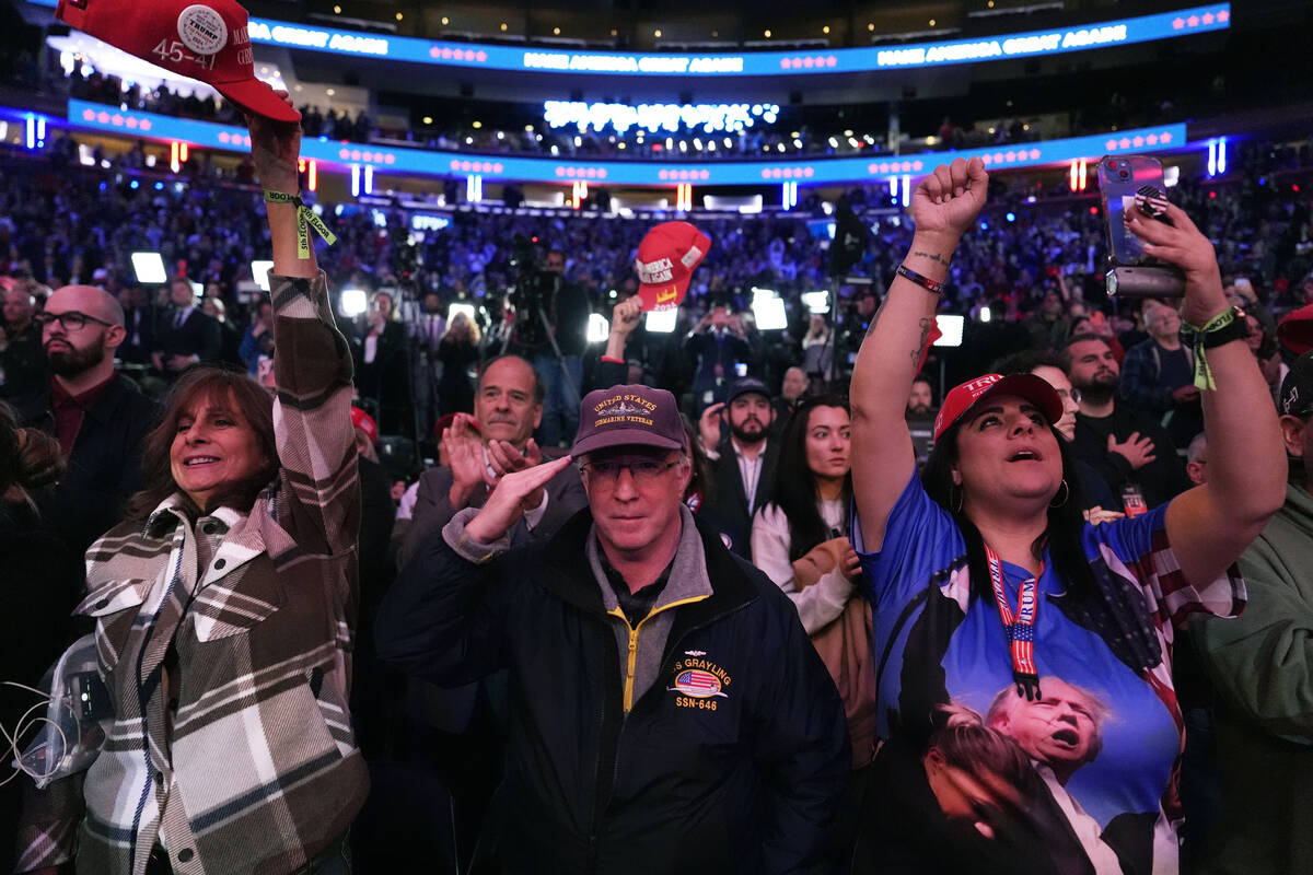 Attendees cheer at a campaign rally for Republican presidential nominee former President Donald ...