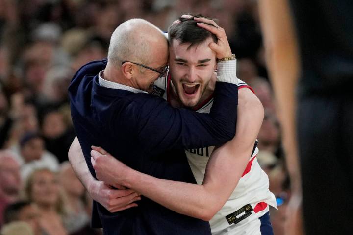 FILE - UConn head coach Dan Hurley celebrates with forward Alex Karaban (11) after their win ag ...