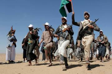 File - Houthi rebel fighters march during a rally of support for the Palestinians in the Gaza S ...