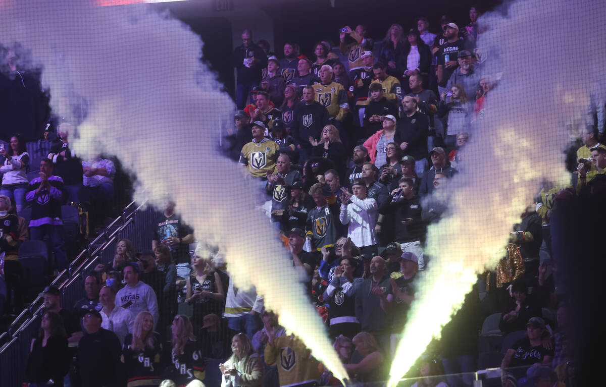 Golden Knights fans cheer before the start of an NHL hockey game against the Calgary Flames at ...