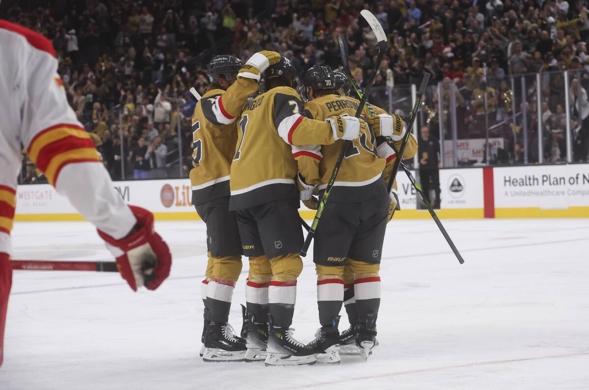 The Golden Knights celebrate after a goal by defenseman Alex Pietrangelo (7) against the Calgar ...