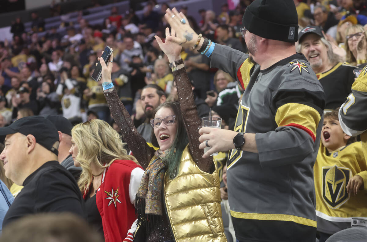 Golden Knights fans celebrate a goal against the Calgary Flames during the first period of an N ...