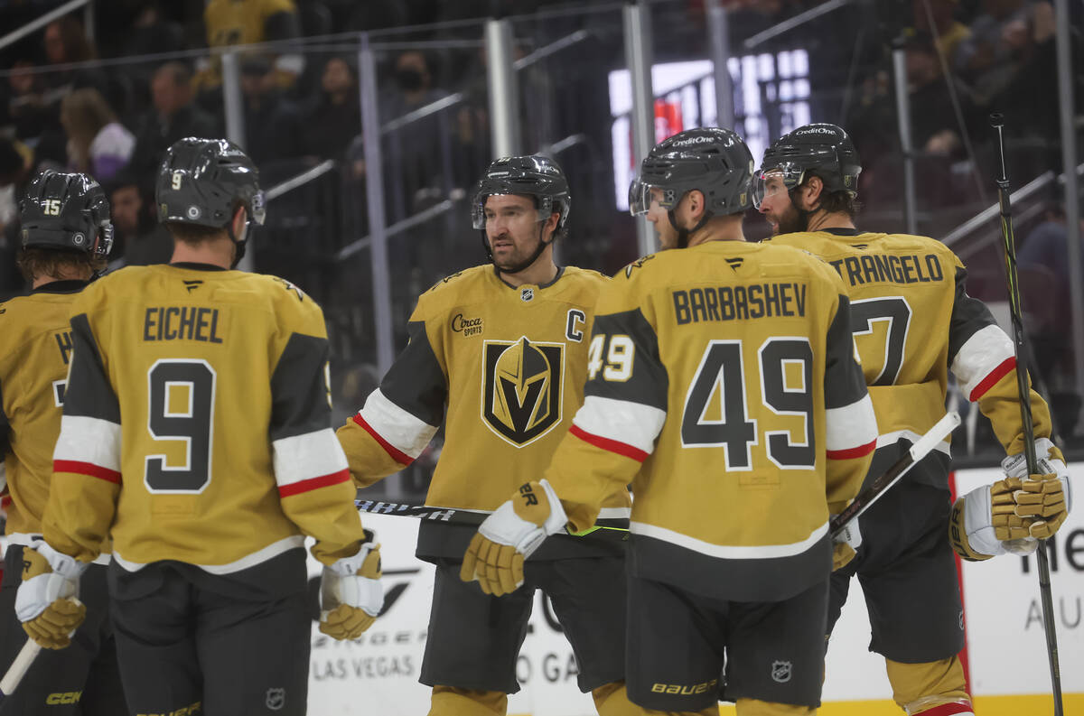 Golden Knights right wing Mark Stone, center, talks with teammates during the second period of ...