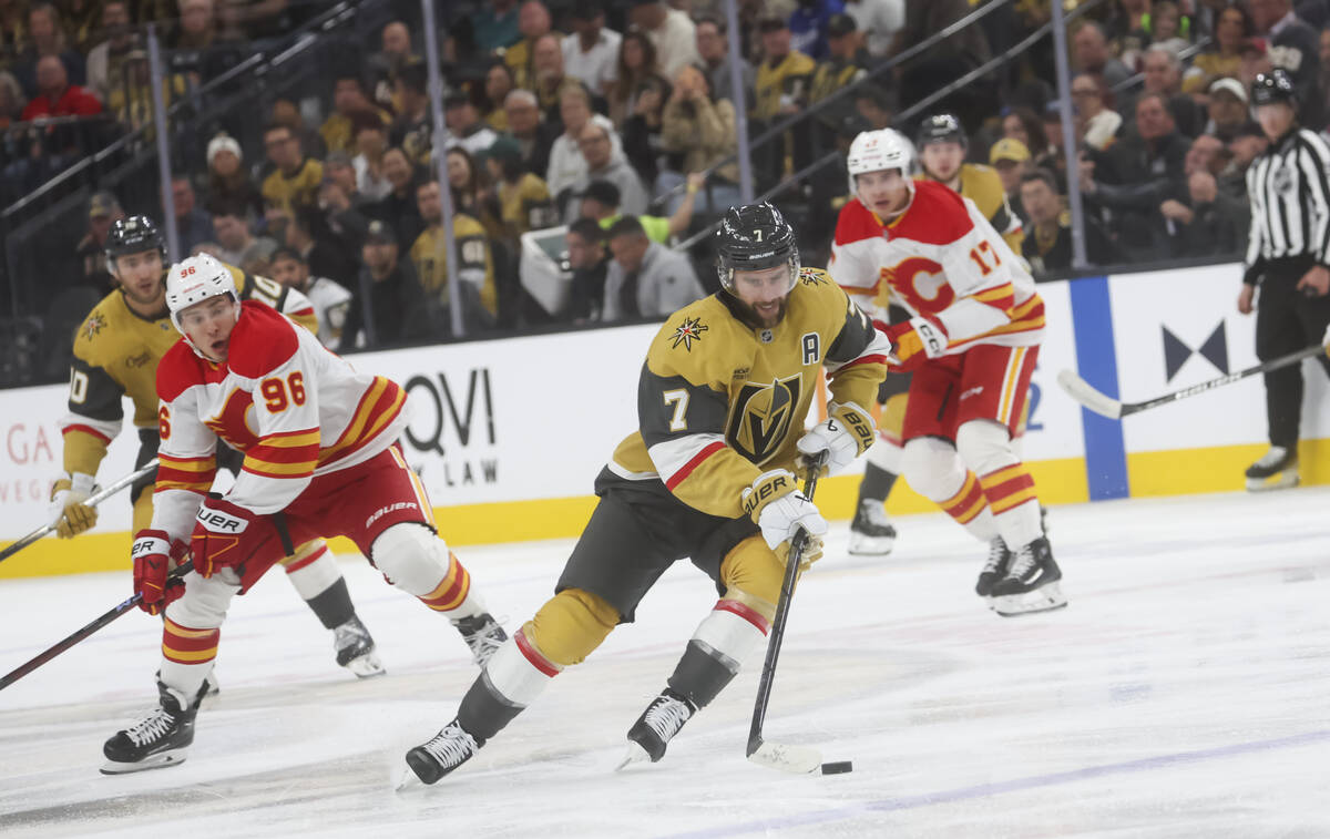 Golden Knights defenseman Alex Pietrangelo (7) skates with the puck against the Calgary Flames ...